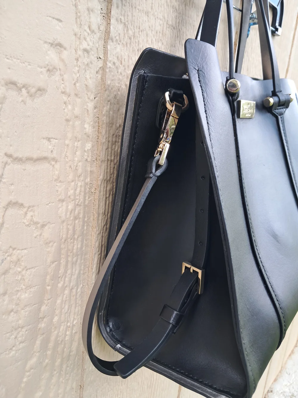 Kate Spade New York black leather tote bag with shoulder strap​